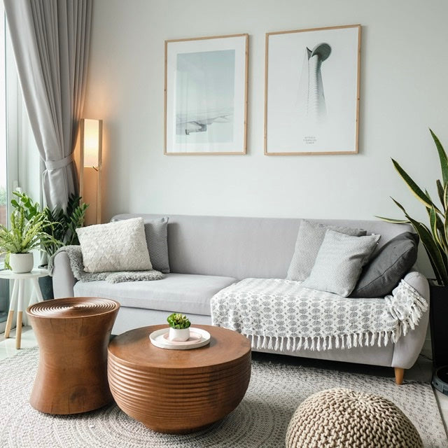 Living room with wall art matching in neutral tones
